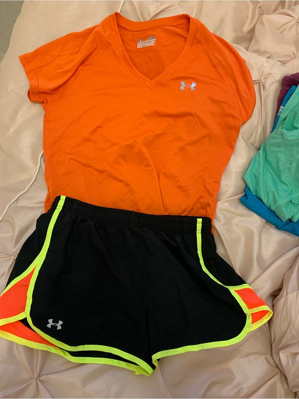 Under Armour Black Athletic Shorts with Neon Yellow Trim and Orange Mesh Accents